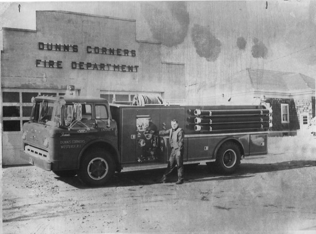 From the Archives:  This shot from the Westerly Sun on 1/31/67 shows the department's new E4.  The caption reads: &quot;The Dunn's Corners Fire Department's new $23,000 fire pumper arrived from the manufacturer last week, and took its place in the line this morning.  Fireman Andrew Haggerty stands before the big truck that will be able to pump 1000 gallons of water per minute.  Purchase of the truck was approved by the Dunn's Corners Fire District more than 18 months ago and the order was placed in October of 1965.  A delay in construction of the truck chassis held up delivery of the truck for more than a year.  The new truck carries 1000 gallons of water, has 3000 feet of fire hose and has all other equipment necessary for fire protection.  The pumper was built by the Farrar company of Woodville, MA.  Firemen had to build an addition to the fire station to house the apparatus.  It takes the place of a pumper assigned to the Quonochontaug station of the Dunn's Corners Department.&quot;